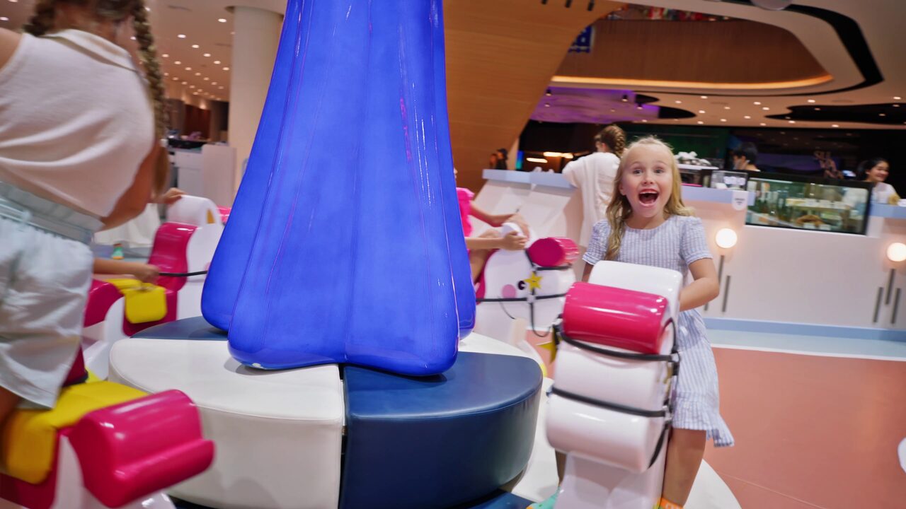 Children riding the carousel play ride