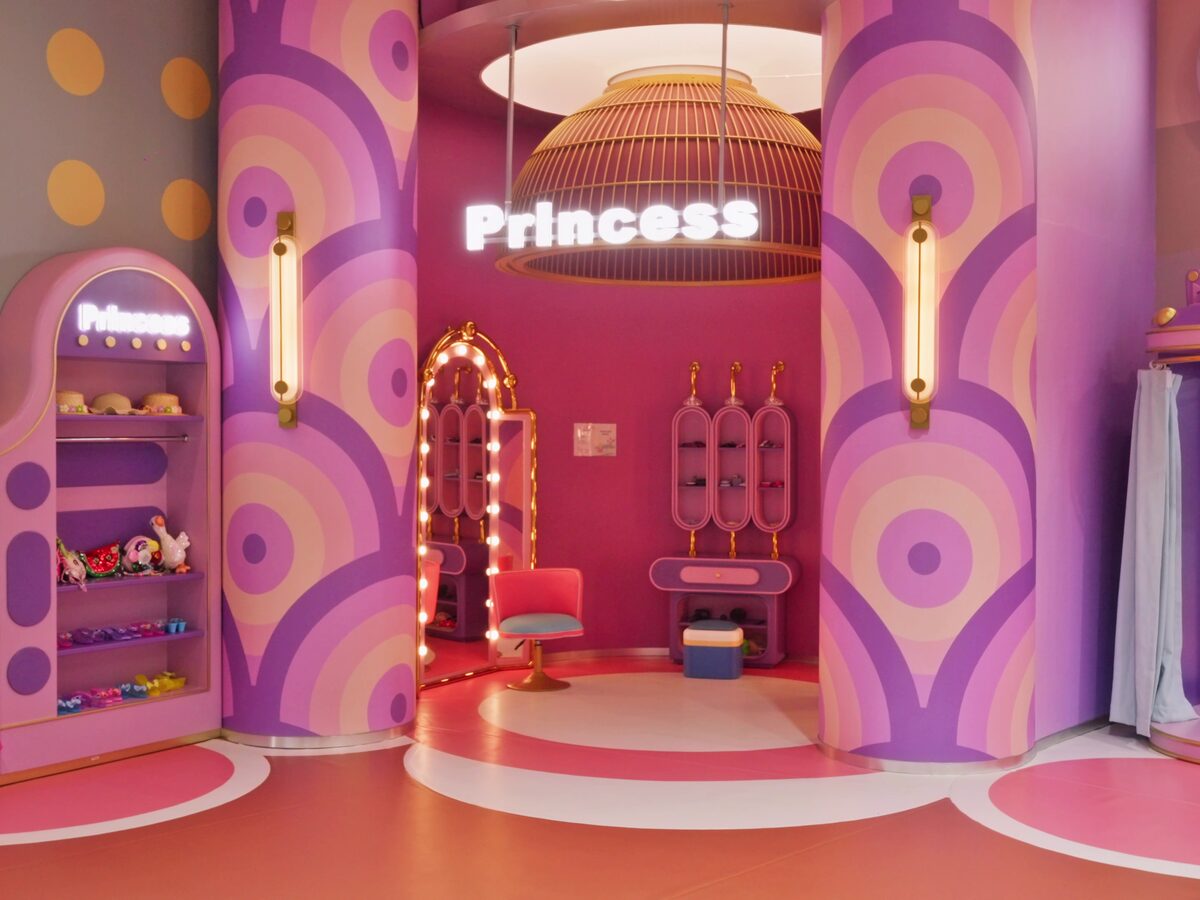 Princess dress-up room with costumes and vanity mirror